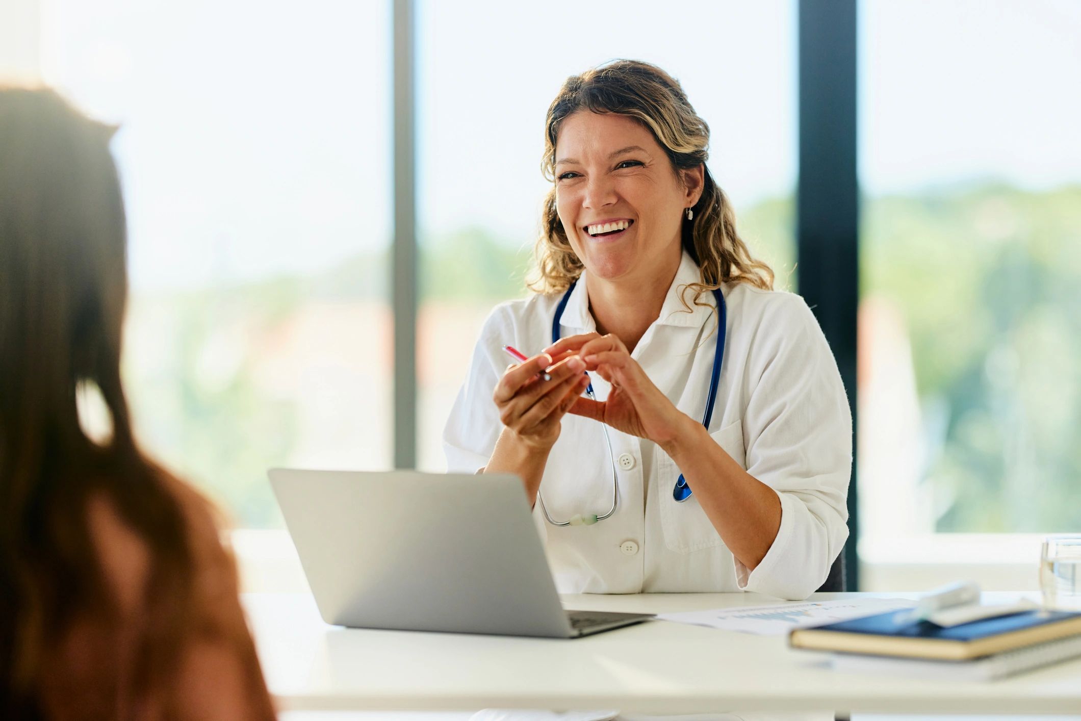 Consultation in a healthcare office representing admin and operational support