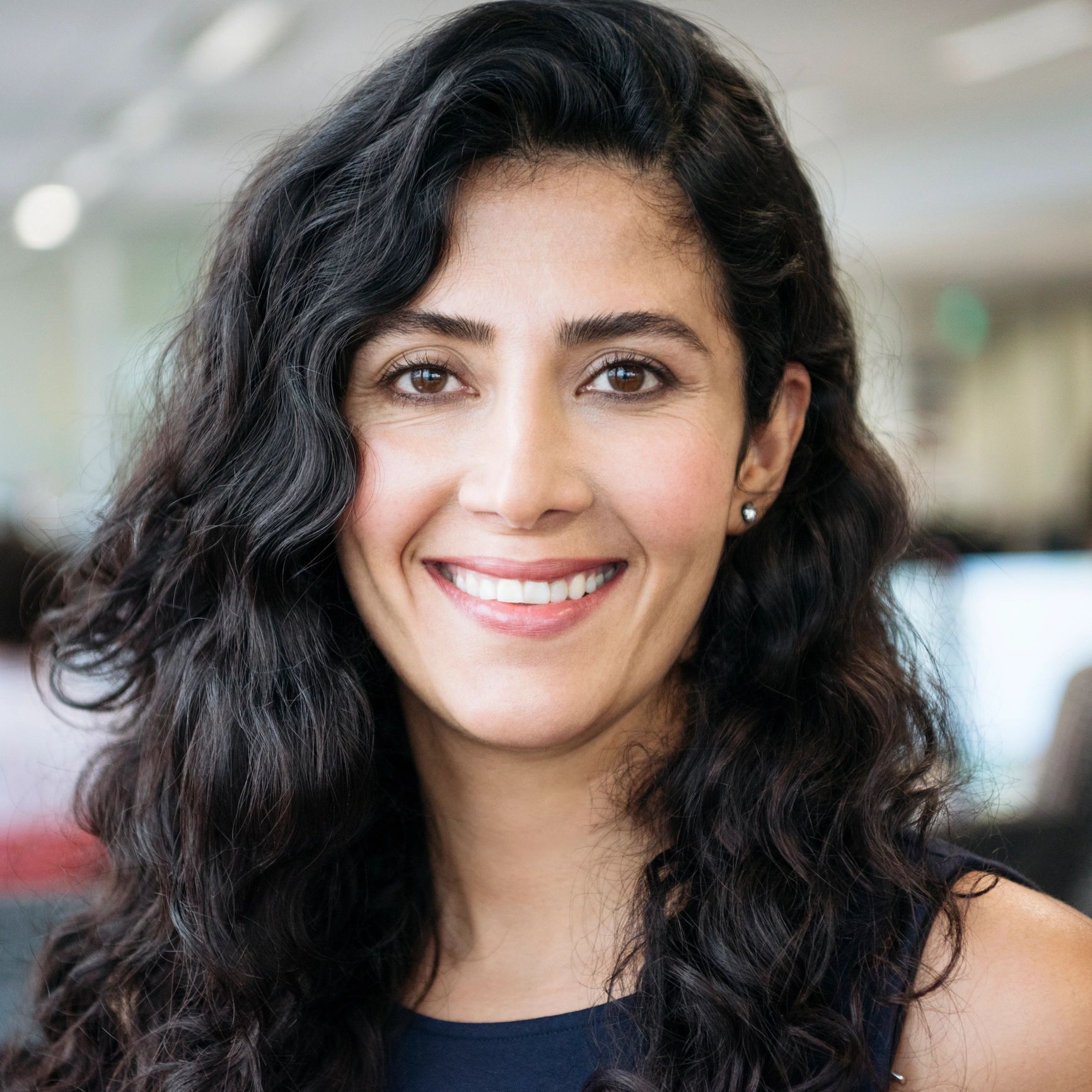 Professional headshot representing a pharmacy owner
